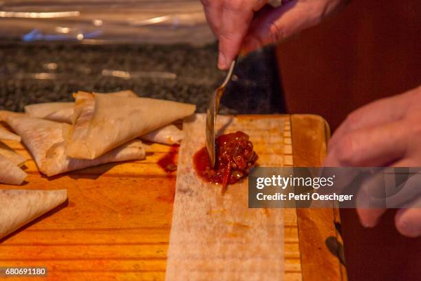 making samosas. - samosa stock pictures, royalty-free photos & images