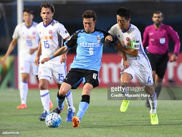 Yusuke Tasaka of Kawasaki Frontale and Bai He of Eastern SC compete for the ball during the AFC Champions League Group G match between Kawasaki...