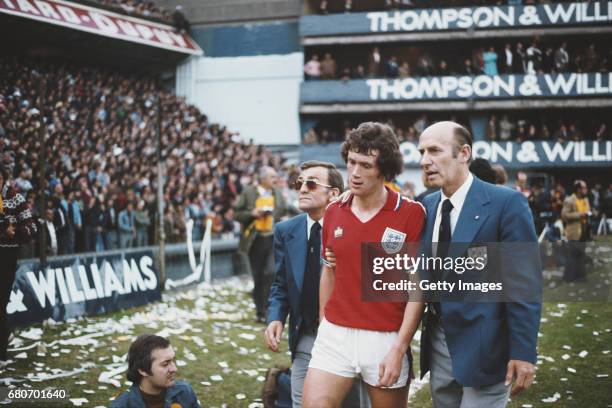 England player Trevor Cherry is led off by FA officials in his red admiral away kit after being sent off with Daniel Bertoni of Argentina during the...