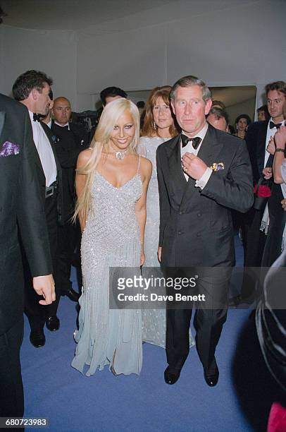 Italian fashion designer Donatella Versace with Prince Charles at the 'Diamonds Are Forever' fashion show, hosted by De Beers and Versace at Syon...