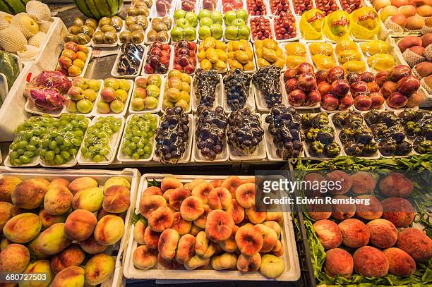 fruit at the donghuamen snack night market - wangfujing stock pictures, royalty-free photos & images