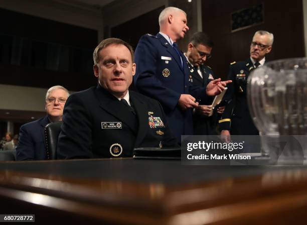 Navy Adm. Michael Rogers, commander of the U.S. Cyber Command, and Director of the National Security Agency, waits to testify during a Senate Armed...