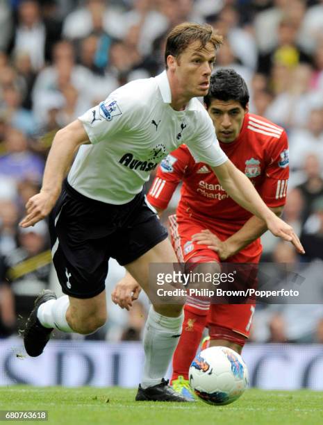 Scott Parker of Tottenham and Luis Suarez of Liverpool in action during the Barclays Premier League match between Tottenham Hotspur and Liverpool at...