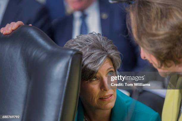 Sens. Joni Ernst, R-Iowa, left, and Deb Fischer, R-Neb., talk before a Senate Armed Services Committee hearing in Dirksen Building titled "United...