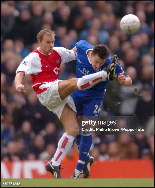 Dennis Bergkamp of Arsenal and John Terry of Chelsea in action during the FA Cup fifth round match between Arsenal and Chelsea at Highbury in London...