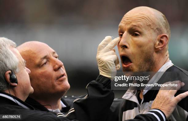 Stirling Mortlock of The Barbarians has his eye treated during the Killik Cup match between The Barbarians and Australia at Twickenham Stadium in...