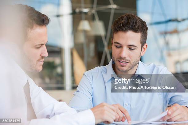 insurance agent explaining contact to client - human body part stock pictures, royalty-free photos & images