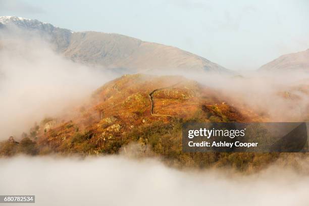 valley mist over ambleside looking towards todd crag lake district, uk. - loughrigg fells stock-fotos und bilder