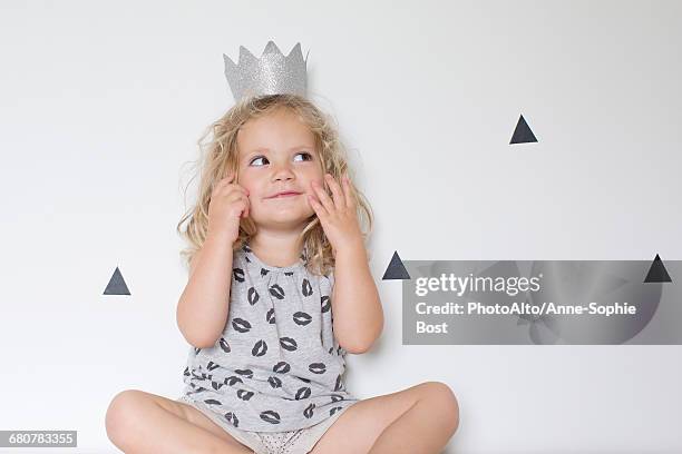 little girl wearing a paper crown - triangle day 2 stock-fotos und bilder