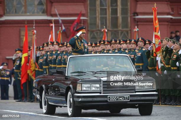 Russian Defence Minister Sergei Shoigu rides a ZIL Cabriolette during the Victory Day military parade to celebrate the 72nd anniversary of the...