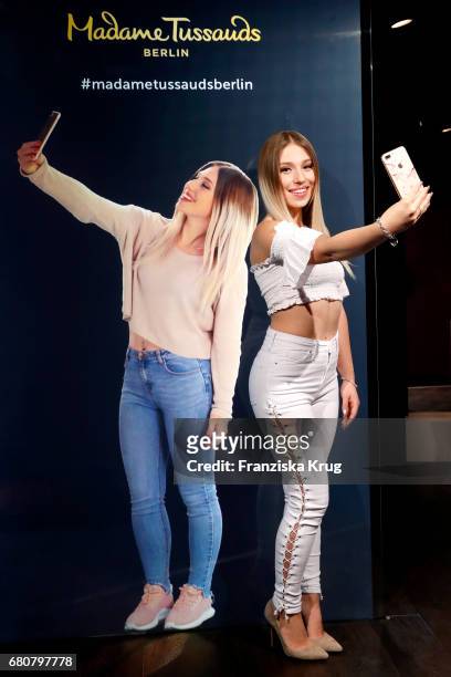 Youtube-Star Bianca 'Bibi' Heinicke poses next to a hologram of her at Madame Tussauds on May 9, 2017 in Berlin, Germany. Bibi's hologram is the...