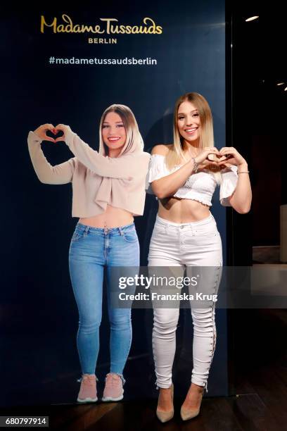 Youtube-Star Bianca 'Bibi' Heinicke poses next to a hologram of her at Madame Tussauds on May 9, 2017 in Berlin, Germany. Bibi's hologram is the...