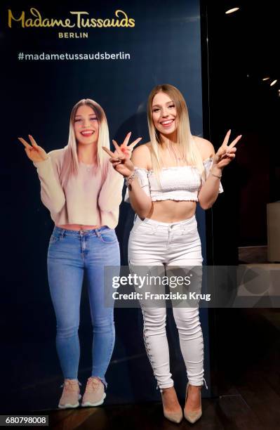 Youtube-Star Bianca 'Bibi' Heinicke poses next to a hologram of her at Madame Tussauds on May 9, 2017 in Berlin, Germany. Bibi's hologram is the...