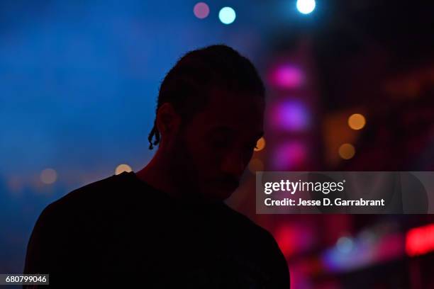 Kawhi Leonard of the San Antonio Spurs stands on the court before Game Four of the Western Conference Semifinals against the Houston Rockets during...