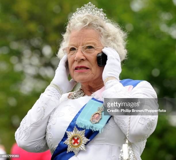 Queen lookalike Patricia Ford during a gathering in Bucklebury near Reading on the day that Kate Middleton married Britains Prince William in...