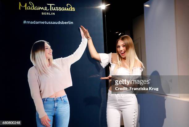 Youtube-Star Bianca 'Bibi' Heinicke poses next to a hologram of her at Madame Tussauds on May 9, 2017 in Berlin, Germany. Bibi's hologram is the...