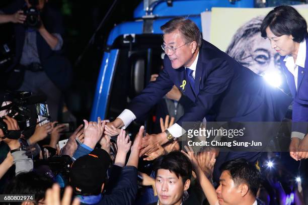 South Korean President-elect Moon Jae-in, of the Democratic Party of Korea, celebrates with supporters at Gwanghwamun Square on May 9, 2017 in Seoul,...