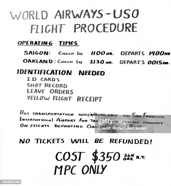 Hand-lettered sign posted in a U.S. Navy barracks at Da Nang Air Base in South Vietnam in 1970 advertises World Airways/USO flights from Saigon,...