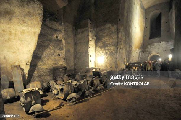 Some vintage cars and motorcycles in the Borbone family´s tunnel, an underground way used by Mlitary Forces during the World War II and then used by...