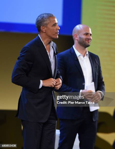 Former US President Barack Obama speaks with Sam Kass during the Seeds&Chips Global Food Innovation Summit on May 9, 2017 in Milan, Italy. The...