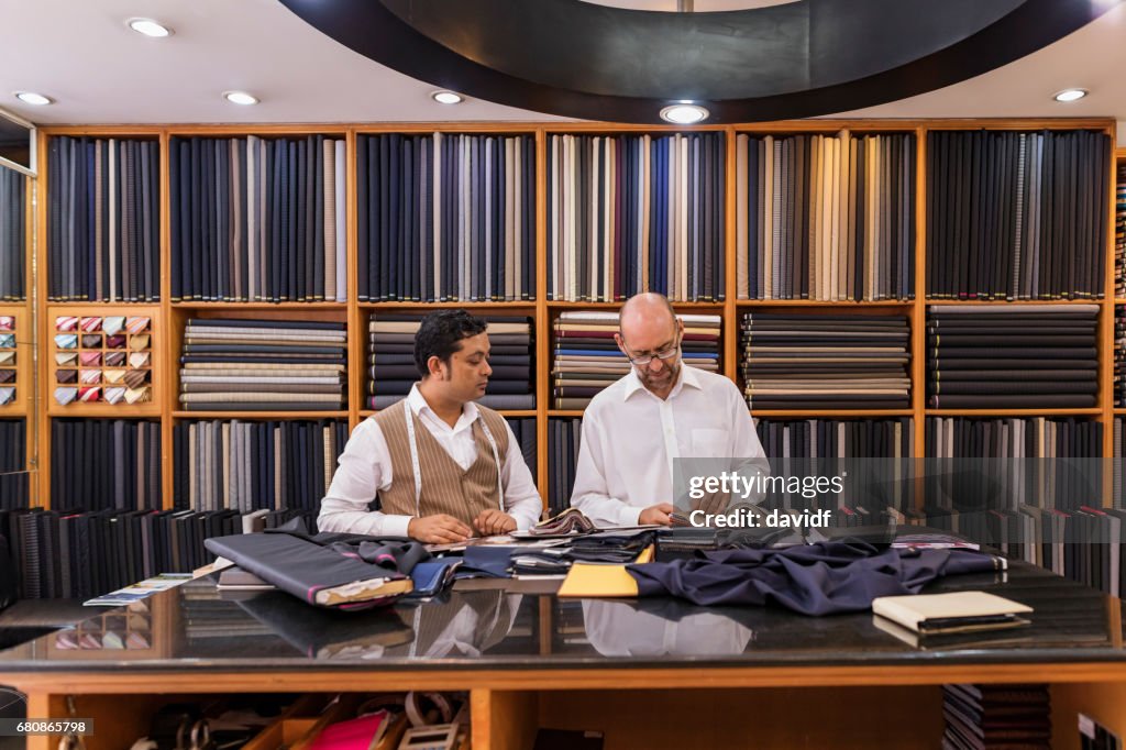 Business Man Selecting Fabric For a Custom Tailored Suit