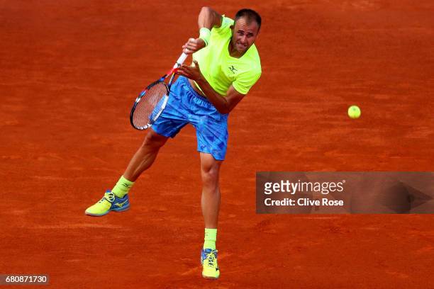 Marius Copil of Romania in action against Andy Murray of Great Britain during day four of the Mutua Madrid Open tennis at La Caja Magica on May 9,...