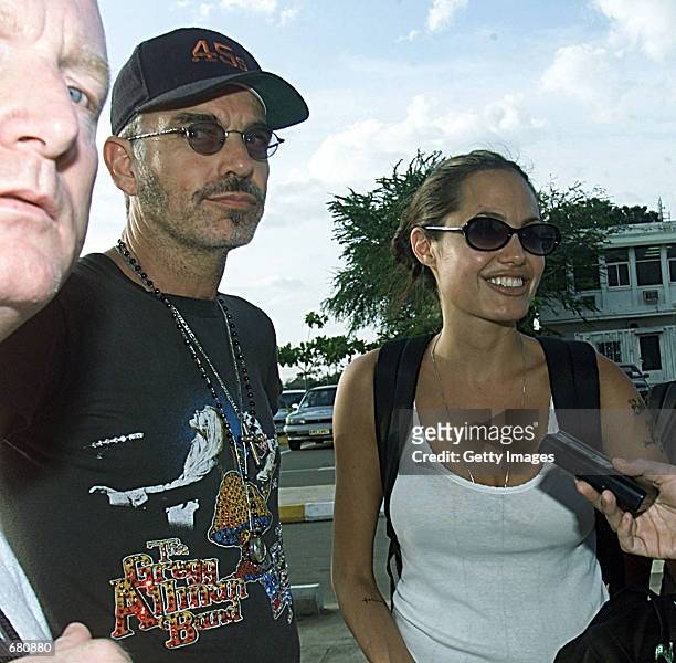 Husband and wife actors Billy Bob Thornton and Angelina Jolie talk with reporters November 7, 2001 in Phnom Penh, Cambodia. Jolie is a goodwill...