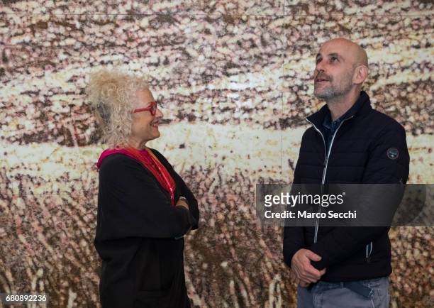 Tami Katz-Freiman curator for the Israeli pavilion and artist Gal Weinstein pose for a picture at the press preview of the exhibition "Sun Stand...