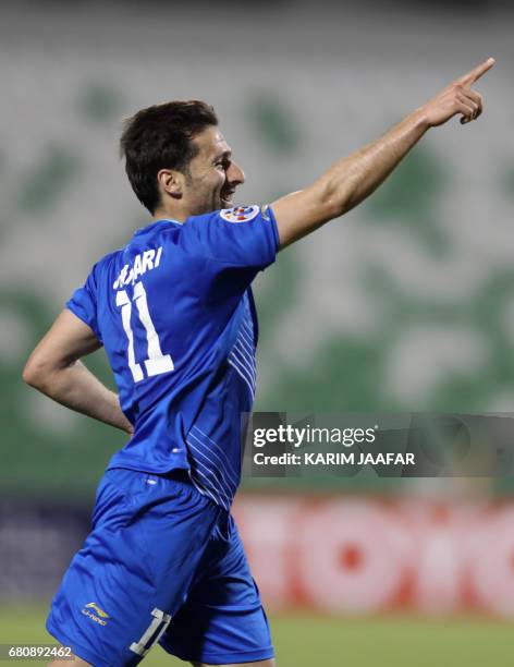 Esteghlal's forward Jaber Ansari celebrates after scoring a goal during their Asian Champions League football match between Iran's Esteghlal FC and...