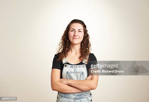 portrait of confident young woman - overall stock pictures, royalty-free photos & images