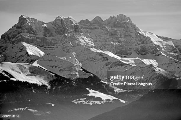 the dents du midi mountain (french for "the teeth of the south") - dents du midi stockfoto's en -beelden