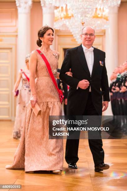 Prince Albert of Monaco and Crown Princess Mary of Denmark arrive for a gala dinner at the Royal Palace in Oslo, Norway on May 9, 2017 to mark the...