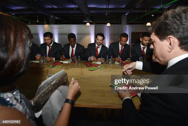 Emre Can, Divock Origi, Danny Ings, Joel Matip and Kevin Stewart of Liverpool sign autographs during the Liverpool FC Player Awards at Anfield on May...