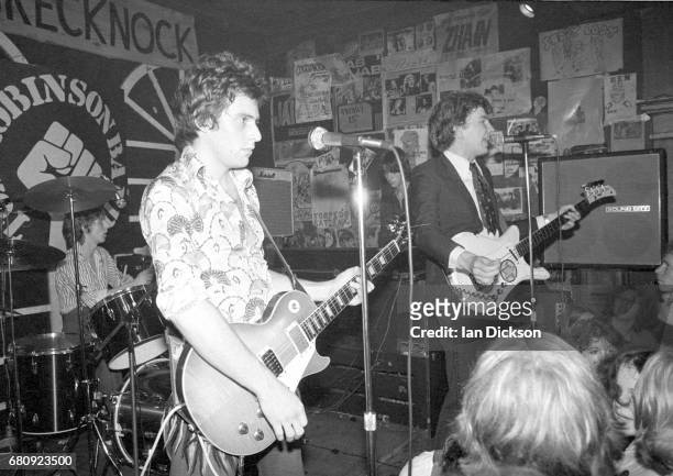 Danny Kustow and Tom Robinson of the Tom Robinson Band performing on stage at The Brecknock, London, 30th August 1977.