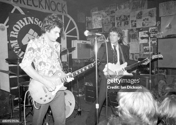 Danny Kustow and Tom Robinson of the Tom Robinson Band performing on stage at The Brecknock, London, 30th August 1977.