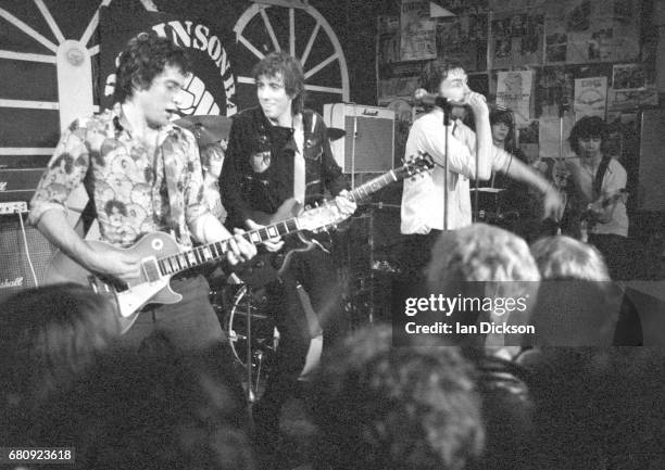 Danny Kustow and Tom Robinson of the Tom Robinson Band performing on stage with Mick Jones of The Clash and Glen Matlock of the Rich Kids at The...