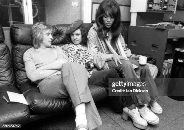 Mick Ronson, Marc Bolan and Gloria Jones share a sofa in the control room at Air Studios, Oxford Street, London, 1974 during the recording of the...