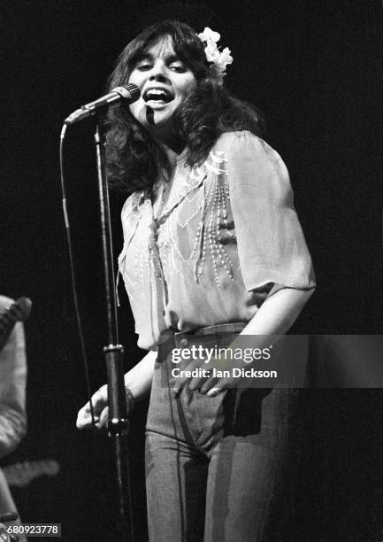 Linda Ronstadt performing on stage at New Victoria Theatre, London, 1974.