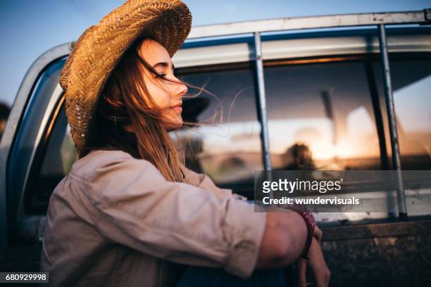 young woman in a pick-up truck during a road trip - retro cowgirl stock pictures, royalty-free photos & images