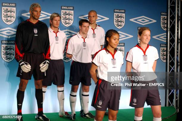 England's David James, David Beckham, Michael Owen, Rio Ferdinand, Rachel Yankey and Casey Stoney show the new England home kit