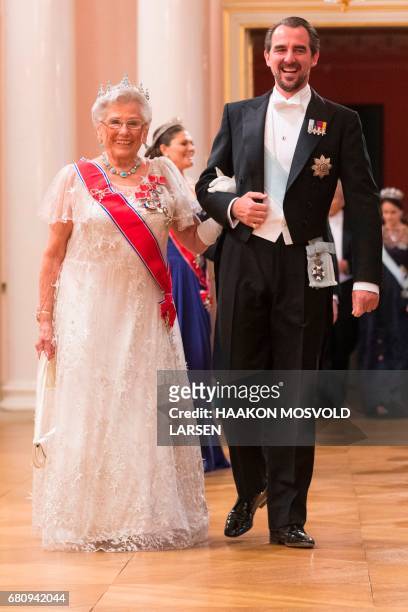 Prince Nikolaos of Greece and Princess Astrid of Norway arrive for a gala dinner at the Royal Palace in Oslo, Norway on May 9, 2017 to mark the 80th...