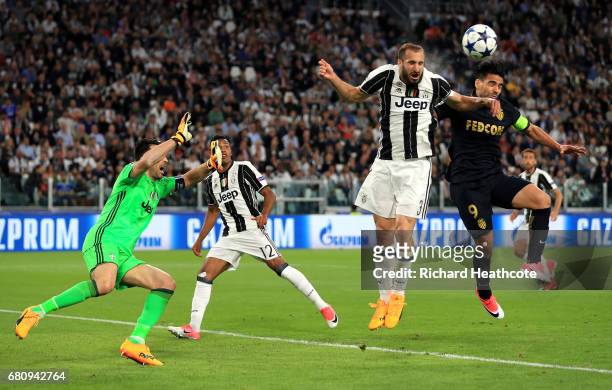 Giorgio Chiellini of Juventus clears the ball as he is put under pressure by Radamel Falcao Garcia of AS Monaco during the UEFA Champions League Semi...