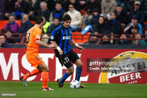 Inter Milan's Francesco Coco takes on Valencia's Anthony Reveillere