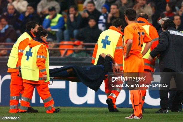 Inter Milan's Francesco Coco is stretchered off injured against Valencia