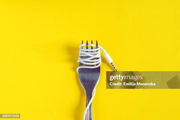 connecting through technology. cable wrapped around a fork - bent fork stock pictures, royalty-free photos & images