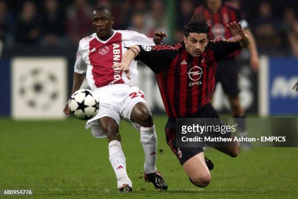Milan's Kakha Kaladze and Ajax's Abubakari Yakubu