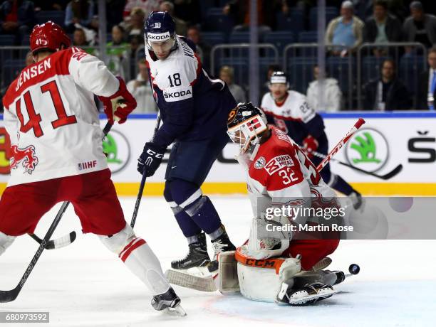 Andrej Kudrna of Slovakia fails to score over Sebastian Dahm, goaltender of Denmark during the 2017 IIHF Ice Hockey World Championship game between...