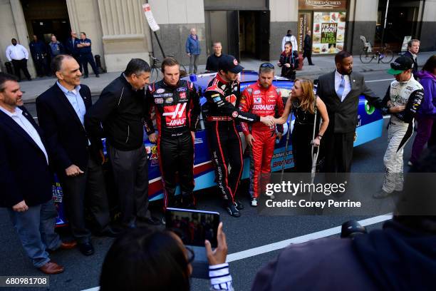 Ben Kennedy , driver of the No. 9 Rheem Chevrolet, reaches to shake hands with Sheila Hess, City Representative, on May 9, 2017 in Philadelphia,...