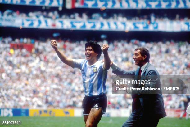 Argentina's Diego Maradona celebrates with Manager Carlos Bilardo after winning the World Cup final match against West Germany
