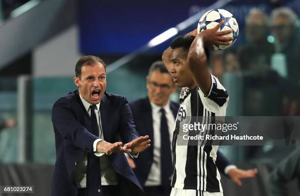 Massimiliano Allegri, Manager of Juventus gestures towards Alex Sandro of Juventus during the UEFA Champions League Semi Final second leg match...